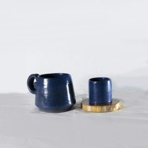 Two blue mugs on a table