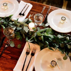 White ceramic dinner plates on a wooden table