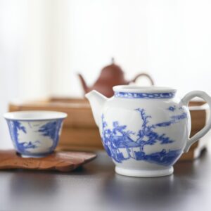 Porcelain teapot and tea cup