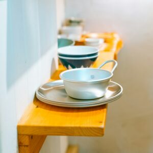 White ceramic teacup on a wooden table